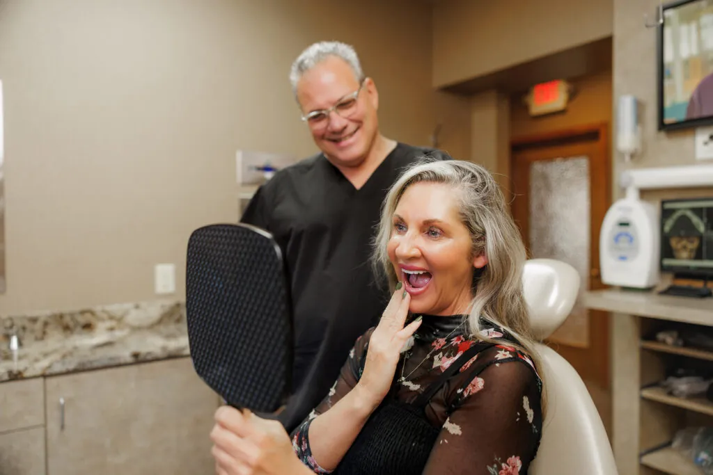 Patient reviewing their dental treatment results with the dentist